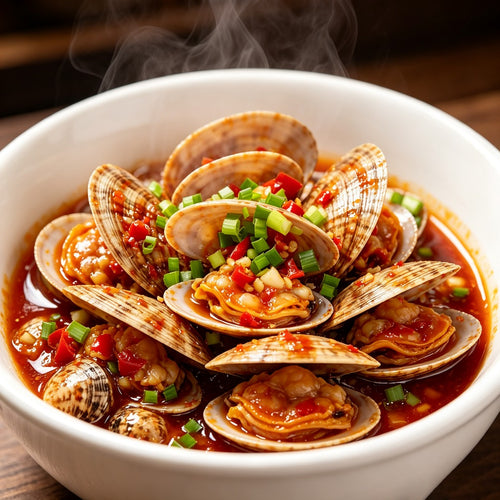 Spicy stir-fried clams in chilli sauce with spring onion