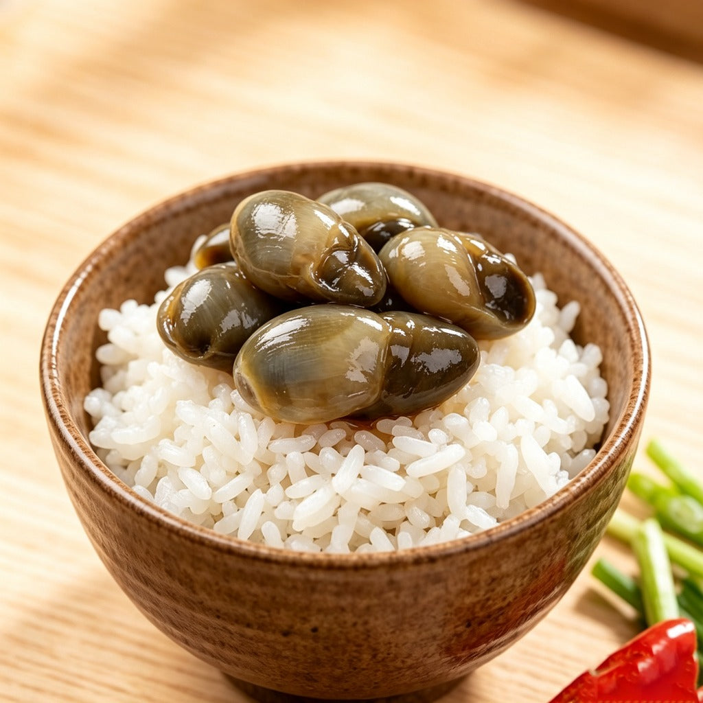 Marinated mud snails served over steamed rice in a bowl